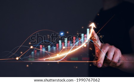 Businessman drawings growth graph of business. Business strategy development and growing growth plan. Royalty-Free Stock Photo #1990767062