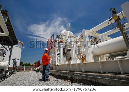 Male worker inspection at steel long pipes and pipe elbow in station oil factory during refinery valve of visual check record