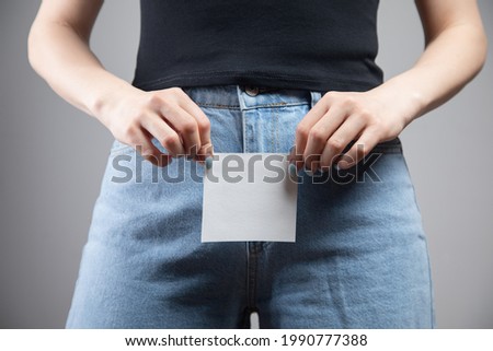 young girl holding a piece of paper