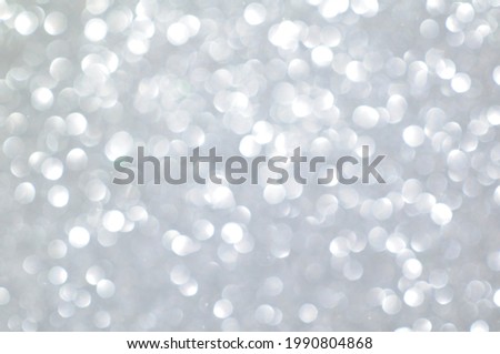 white colour glittering bokeh lights on blur background