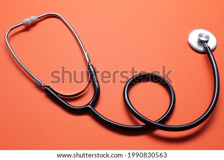 Blue stethoscope on blue background