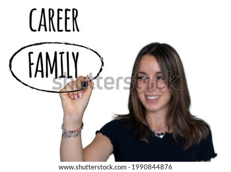 Pretty young caucasian woman writing with marker on white background prefers family to career. Concept of traditional values.