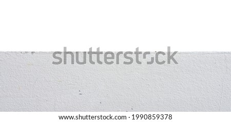 Horizontal front view of white cement floor in foreground, isolated in white background. Copy space in on above the cement floor. Usable for any design artworks. Royalty-Free Stock Photo #1990859378