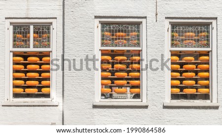 windows with stacks of Dutch cheese