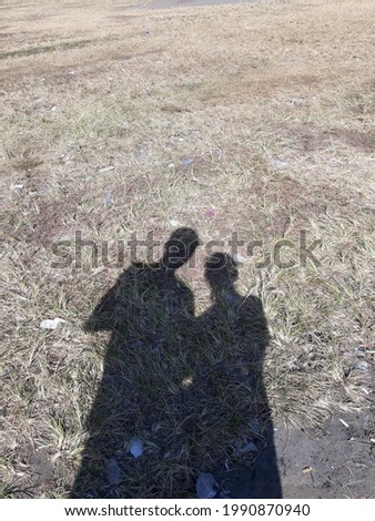 shadow photo of a couple taken during the day