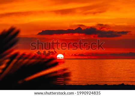 Colorful sea sunset against clouds