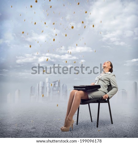 image of a young business woman looking at the falling business signs