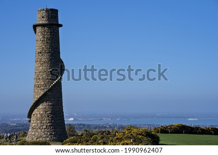 Beautiful bright horizontal view of  Ballycorus lead mining and smelting chimney tower against clear blue sky, Ballycorus, Co. Dublin, Ireland. Copy space. High resolution Royalty-Free Stock Photo #1990962407