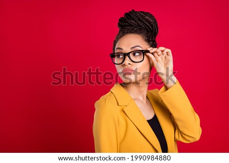 Profile photo of sad confident lady touch eyewear look empty space wear yellow cardigan isolated on vivid red color background