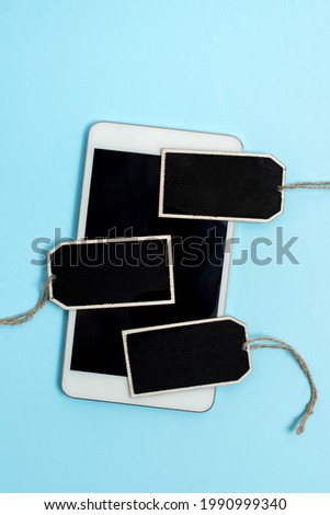 Collection of Real Blank Empty Sticker Card Tag With An Elastic Band On A Different Color Background Containing Modern Gadget Checklist For Labeling Informative Content Purposes