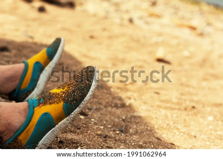 Sand on beach shoes in the Kamenka beach. Russia, Sea of Azov, Krasnodar Territory, Yeysk. Background.