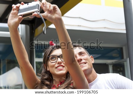 boyfriends makes a selfie with a vintage camera
