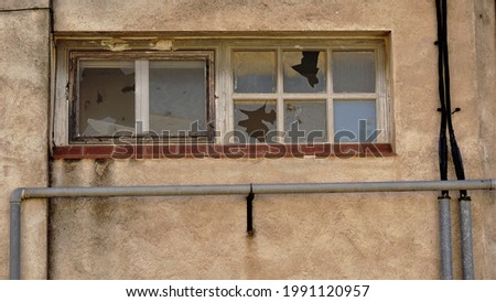 broken windows of abandoned building    