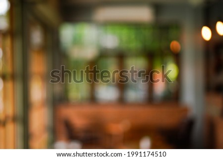 Abstract blur bokeh in restaurant background for texture. Royalty-Free Stock Photo #1991174510