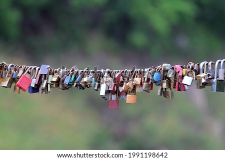 Old padlocks on the bridge as a sign of love forever.