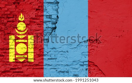 Mongolia flag is painted onto an old brick wall