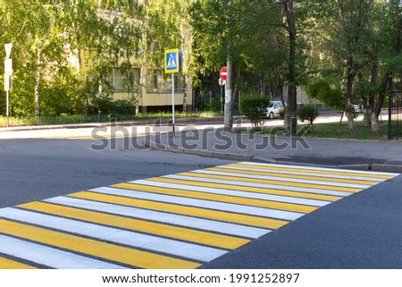 Pedestrian crossing sign on the road