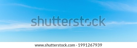 Blue sky with small white clouds in springtime