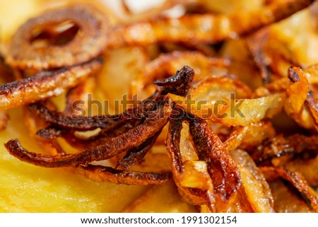 macro photography of fried onion in a plate.