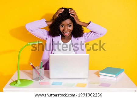 Photo of young happy excited crazy afro businesswoman hold hands head victory isolated on yellow color background