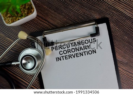 Percutaneous Coronary Intervention write on a paperwork isolated on Wooden Table. Royalty-Free Stock Photo #1991334506