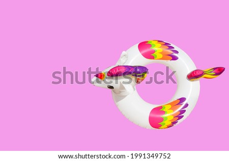 inflatable circle or ring for kids rainbow unicorn for floating in summer vacation isolated on colored background
