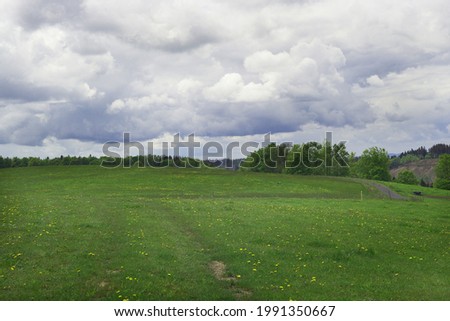  beautiful spring landscape with meadow and hills           