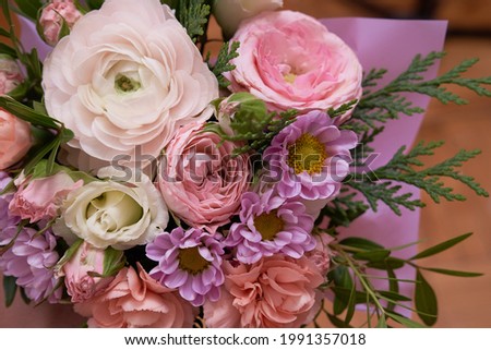 Close up Bouquet of mixed flowers on wooden background, greeting, gift