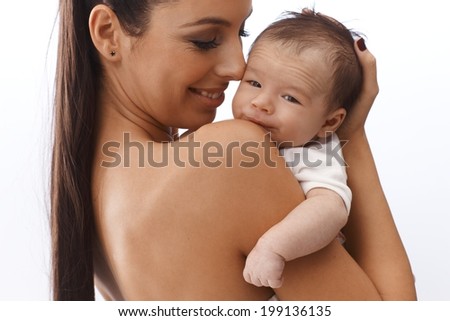 Happy mother caressing newborn baby.
