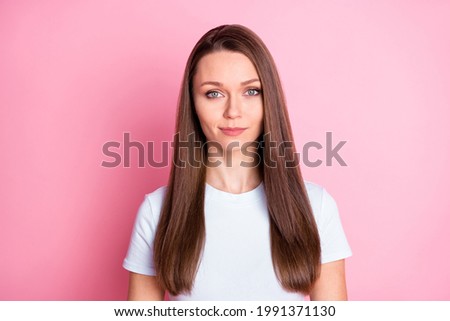 Photo of happy positive smiling lovely pretty woman with long brown straight hair isolated on pink color background