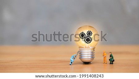 Professional electricians workers performs electric works by stairs. Technicians service staff with tools change light bulb. Innovation in lighting. Landing page technical worker with graphic icon.