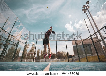 padel player playing a match in the open Royalty-Free Stock Photo #1991435066