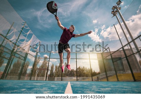 padel player playing a match in the open Royalty-Free Stock Photo #1991435069