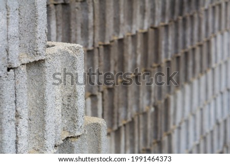 Selective Focus of Cement tile stacked during noon in Semarang, Indonesia. Tiles are constructed for durable yet cheap house. Those hollow space each tile is room for wet cement came in and hardened.