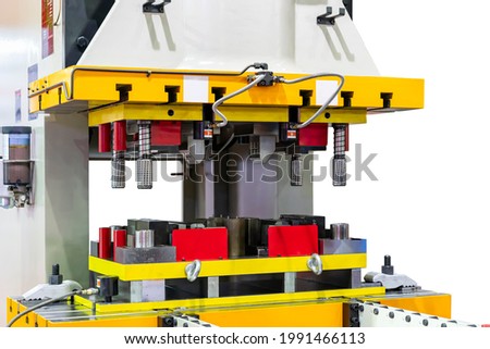 Automatic hydraulic press stamping machine with press mold or die fixture for metal sheet forming in manufacturing process in industrial isolated with clipping path Royalty-Free Stock Photo #1991466113