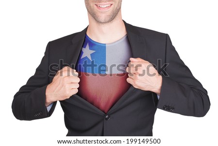 Businessman opening suit to reveal shirt with flag, Chile