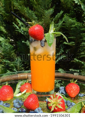 Multifruit juice with ice, fruit and mint