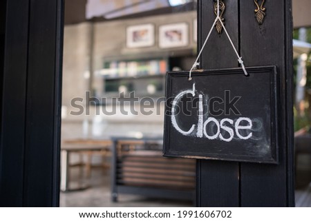 close label on wood door with blur background
