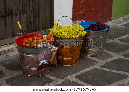 Cherries, Grapes, Chinese Mamon in buckets
