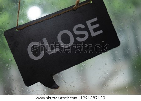 Close up of closed text hanging during raining. Selected Focus