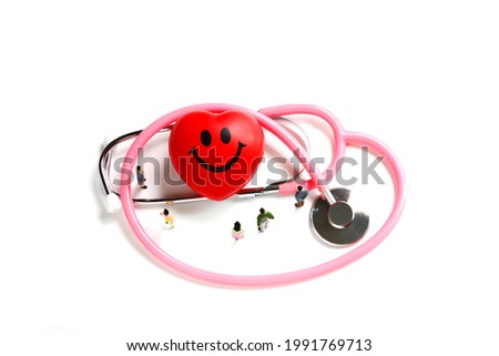 smile pattern on red heart with stethoscope and figure siolate on white