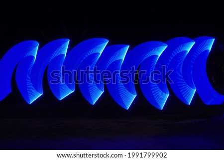 This is a photography technique that uses the bulb technique, which is to use a low shutter speed and then move the lights to form a certain pattern