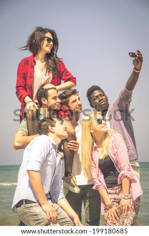 Group of multiracial happy friends taking a selfie