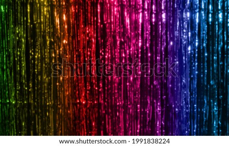 lgbt, decoration and gay symbolic concept - background of foil fringe curtain in rainbow colors Royalty-Free Stock Photo #1991838224