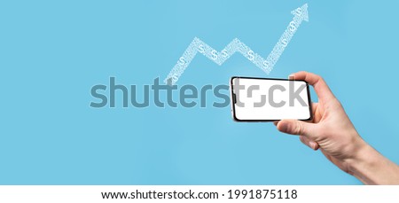 Hand hold drawing on screen growing graph, arrow of positive growth icon.pointing at creative business chart with upward arrows.Financial, business growth concept