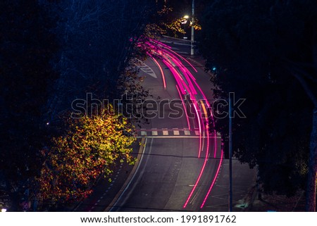 Cool long exposure cars traffic neon light trails, night view, Rome, Italy Royalty-Free Stock Photo #1991891762
