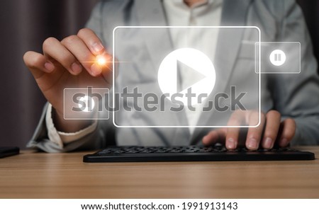 ฺBusinessman touch virtual Online media screen with keyboard Using the Internet to connect to media, video, chat, doing business.