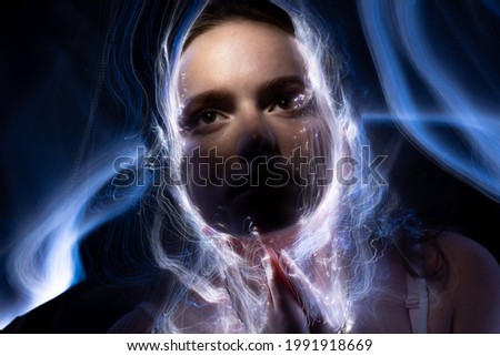 Portrait in the style of light painting. Long exposure photo, abstract portrait