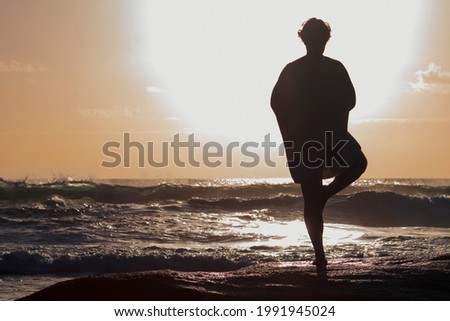 A Girl Doing Yoga At The Beach