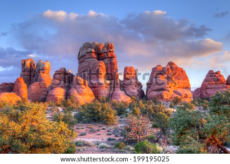 Sunset lit spires in Canyonlands National Park. Royalty-Free Stock Photo #199195025